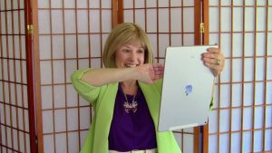 Rose Rosetree does an aura reading from an image on a laptop. Trump's image in 1916.